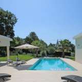  Situated near the village of Roquefort les Pins, close to shops, restaurants, schools and golf, an immaculate recent contemporary villa consisting of a vast reception with fireplace and open fitted kitchen with made to measure units and top quality applia Roquefort-les-Pins 3610269 thumb2