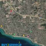  For sale an investment plot of 2 acres in Kallikratia, Chalkidiki, with a frontage of 20m on a road, fenced, within a settlement, outside the plan with water and electricity .Ideal for tourist exploitation, just 6 minutes from the sea, (2km from the b Kallikrateia 8217670 thumb2