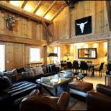  This beautiful chalet of approximately 200 m2 ideally located in the centre of the village offers traditional and contemporary decor on three levels comprising four en-suite bedrooms including a master bedroom with a large dressing room, a dormitory for c Megève 4036996 thumb0