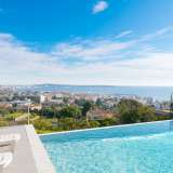  Splendid contemporary villa offering a panoramic sea view a few minutes only from the seashore, the shops and the restaurants.Ground level: Living room, dining room, fully-fitted open kitchen, the whole opening onto a large terrace. 3 be Cannes 4099323 thumb4