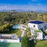  Ideally located in the heart of one of the most sought-after areas in Mougins, splendid contemporary villa offering spacious indoor volumes, and an open view onto the castle of Castellaras.Magnificent garden of more than 10,000 m2 with an over Mougins 4099077 thumb1